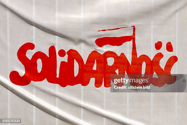 Flag of the Polish trade union Solidarnosc at the main entrance to the Gdansk Shipyard - Stocznia Gdanska.