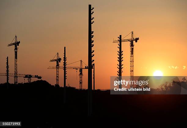 Sunset behind cranes, Munich, July 27, 2013.