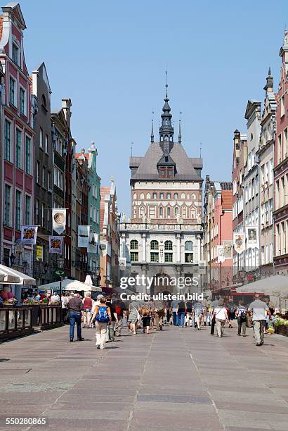 Tourists in front of the Golden Gate in the Long Street from Gdansk.