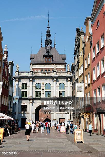 Tourists in front of the Golden Gate in the Long Street from Gdansk.