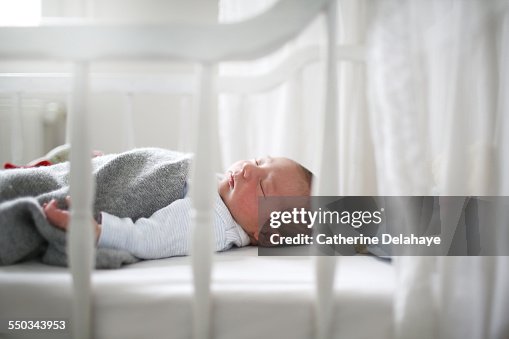 A new born sleeping in his cradle