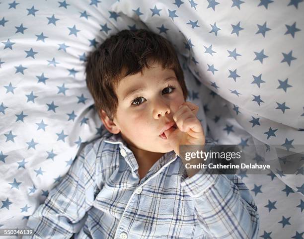 a 3 years old boy sucking his thumb - thumb sucking stock pictures, royalty-free photos & images