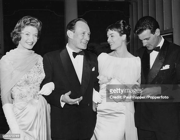 Actors Trevor Howard and Elsa Martinelli attending the premiere of their film 'Manuela' with their respective partners, Count Franco Mancinelli...