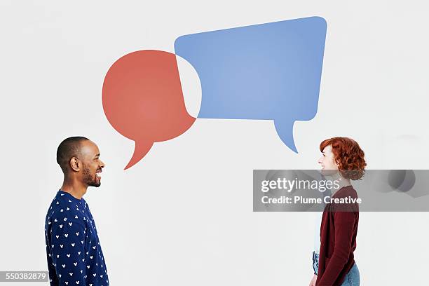 man and woman with overlapping speech bubbles - sharing two people stock pictures, royalty-free photos & images