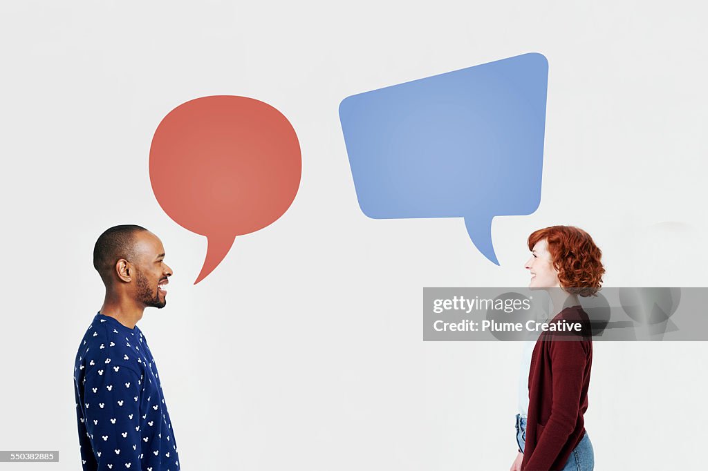 Man and woman with illustrated speech bubbles