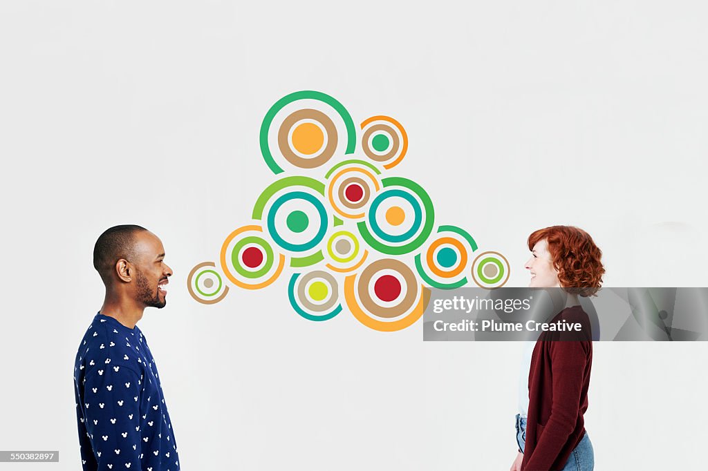 Man and woman with illustrated bubbles