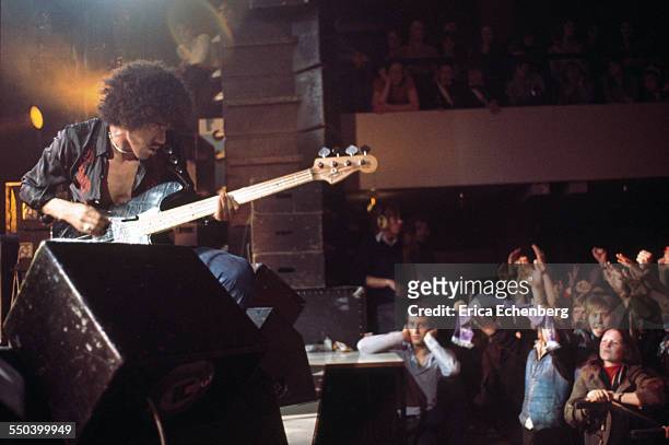 Phil Lynott of Thin Lizzy performs on stage to the front rows of the audience, Leeds, United Kingdom, December 1976.
