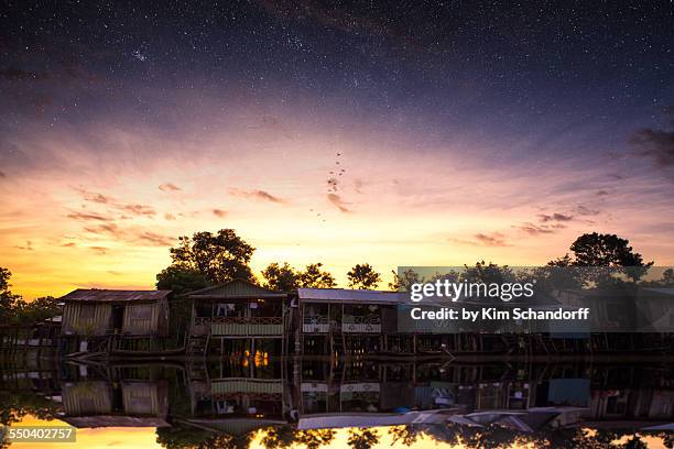 amazon village sunset - amazonas colombia foto e immagini stock