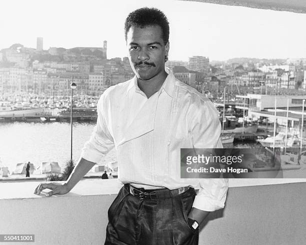 Portrait of singer Ray Parker Jnr on a balcony overlooking the harbor, at Midem Festival, February 1st 1985.