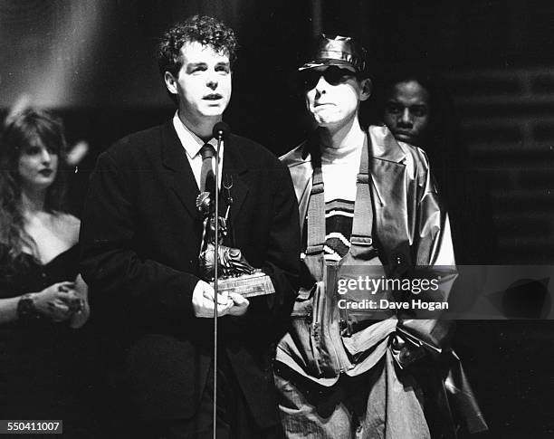 Musicians Neil Tennant and Chris Lowe, of band 'Pet Shop Boys', on stage receiving their award for Best British Group at the BRIT Awards, London,...