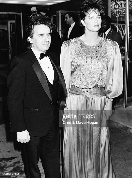 Actor Dudley Moore and his girlfriend Brogan Lane attending the premiere of the film 'Santa Claus: The Movie' in London, November 26th 1985.