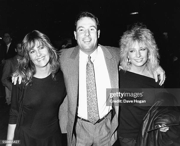 Politician and businessman Derek Hatton, with friends Lisa and Marie, attending the premiere of the movie 'Moonstruck' in London, March 17th 1988.