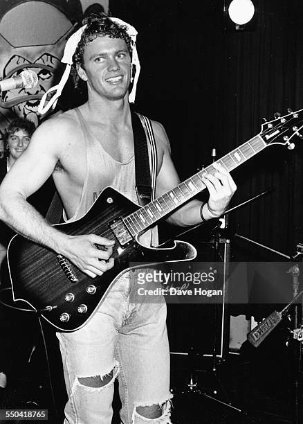 Actor and singer Craig Mclachlan joking around as he performs on stage, circa 1988.