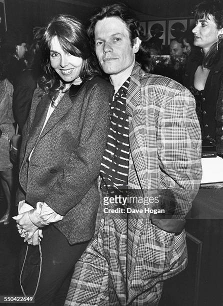 Musician Chris Jagger and his wife attending a party held by Bill Wyman at Sticky Fingers in London, May 11th 1989.