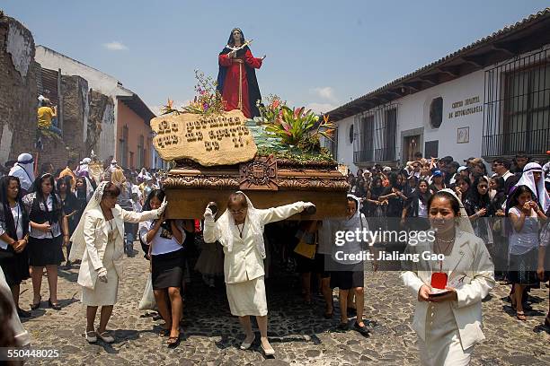 Good Friday procession on the street in Antigua with a woman leading the float. 4/10/2009