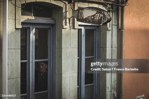 Old man inside a barbershop