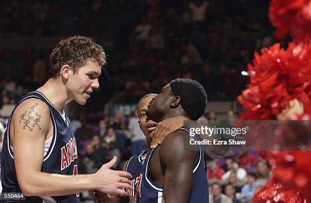 Luke Walton, Jason Gardner and Will Bynum of Arizona during the game in the Coaches vs. Cancer IKON Classic at Madison Square Garden in New York...