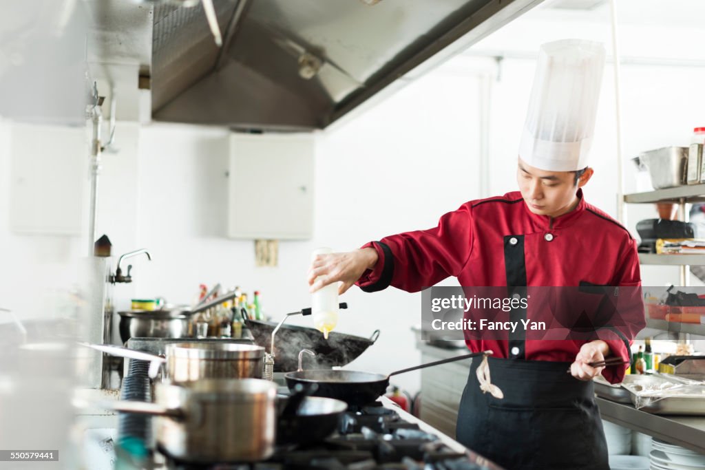 Cook and chef working in restaurant