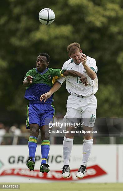 Scott Chipperfield of the Socceroos heads the ball during the FIFA World Cup Qualifying match between the Australian Socceroos and the Solomon...