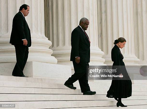 Supreme Court Justices Antonin Scalia, Clarence Thomas and Ruth Bader Ginsburg arrive for services for former U.S. Supreme Court Chief Justice...