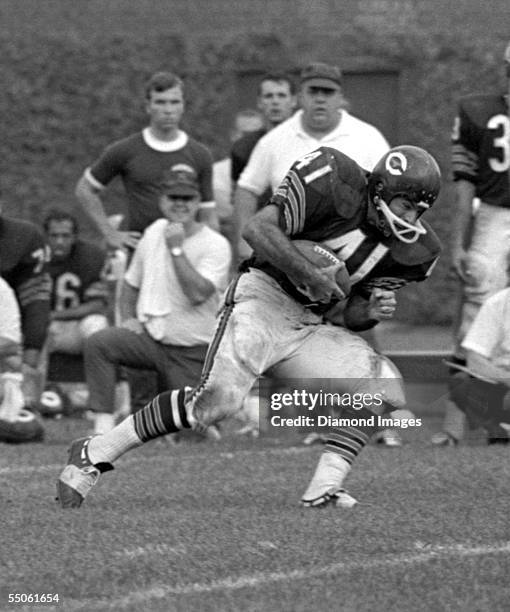Runningback Brian Piccolo, of the Chicago Bears, runs the ball during a game on September 15, 1968 against the Washington Redskins at Wrigley Field...
