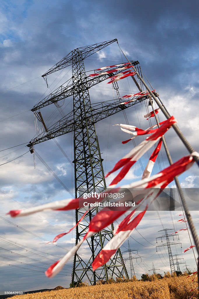 Newly assembled transmission towers and overhead power lines