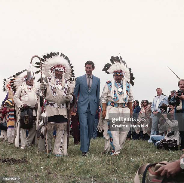 Prince Charles of Wales during a visit - with a medicin man and the Chief of the Blackfoot Tribe Leo Pretty Youngman