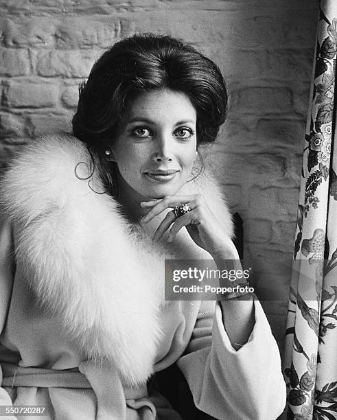 Portrait of American actress Gayle Hunnicutt wearing a fur-trimmed coat, circa 1970.