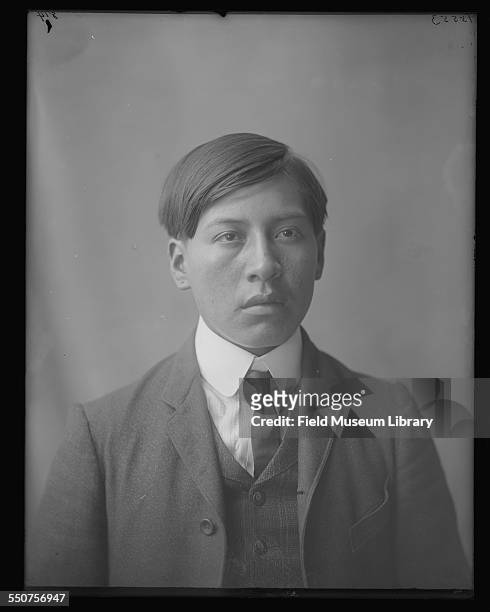 Portrait of Native American Osage tribe member Roy James, aged 19, from Oklahoma, dressed in jacket and tie at the Louisiana Purchase Exposition, St...