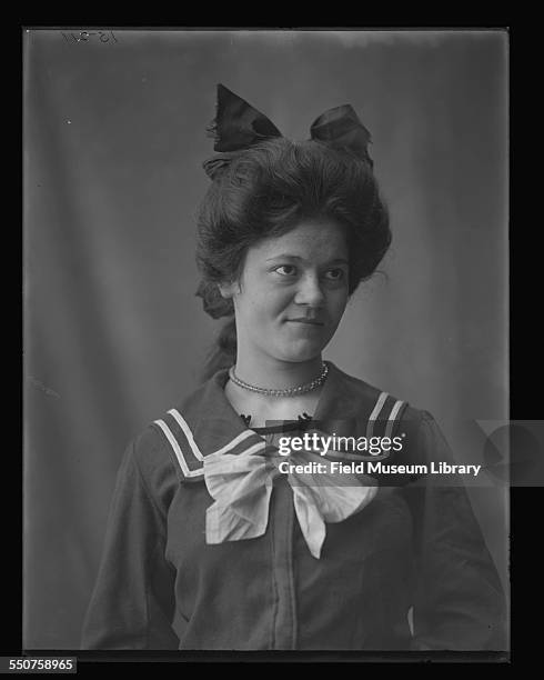 Portrait of a young Native American Cherokee woman, Mary Selby, aged 18 years, wearing a sailor suit type dress with bows on dress and in her hair at...