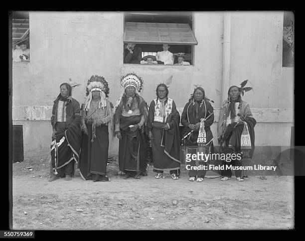Portrait of six Native American Cheyenne men, left to right Edward Bad Hair, Richard A Davis, Bull Bear, Wolf Robe, Chief Bushy Head, Two Lance posed...