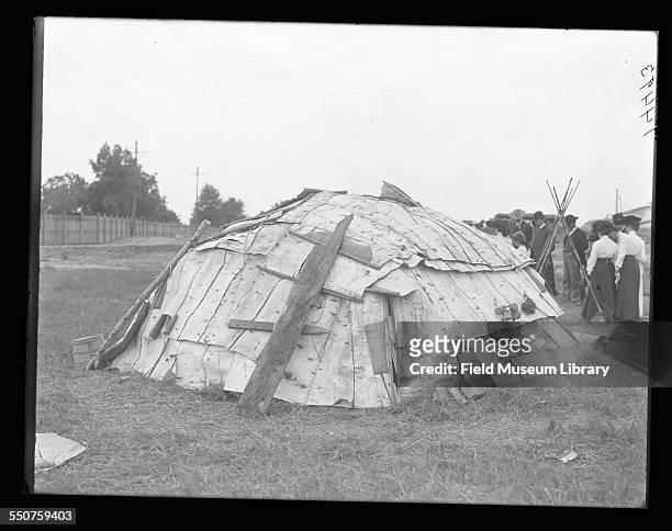 Rear view of a Native American Chippewa or Ojibwa birchbark wigwam hut or lodge constructed on the fair grounds at exposition at the Louisiana...