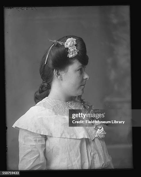 Portrait of Stella Hall, a Native American Cherokee woman wearing a dress with three roses at the Louisiana Purchase Exposition, St Louis, Missouri,...