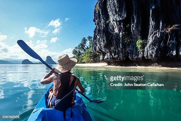 sea kayaking - philippines women stock pictures, royalty-free photos & images