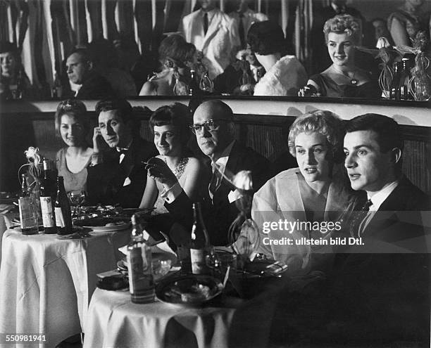 People's Republic of Poland: Elegant people watching a show in a night club in Warsaw