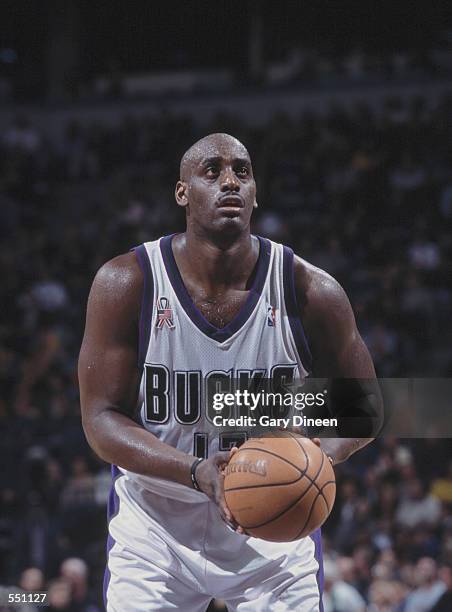 Forward Anthony Mason of the Milwaukee Bucks shoots a free throw during the NBA game against the Atlanta Hawks at the Bradley Center in Milwaukee,...