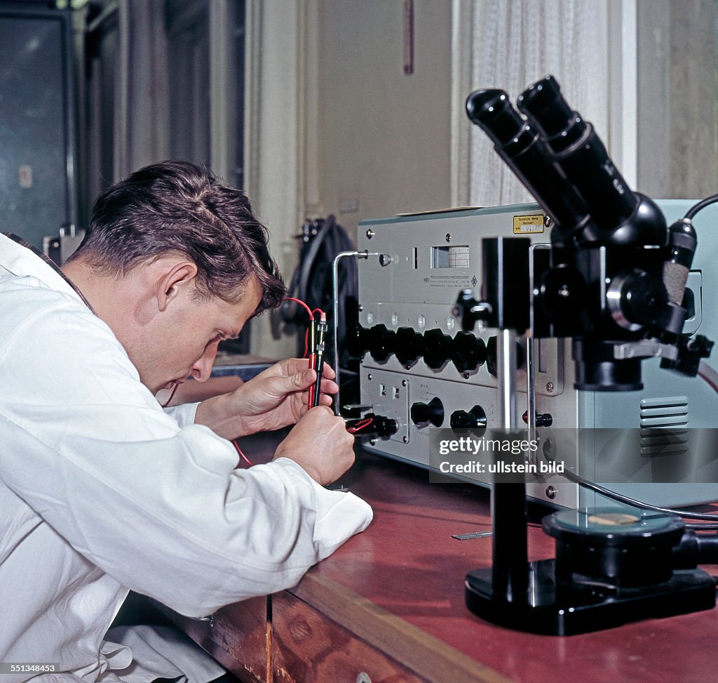 Assistant Working In The Research Institute Manfred Von Ardenne In assistant-working-in-the-research-institute-manfred-von-ardenne-in