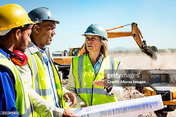 construction team planning at quarry - earth mover stockfoto's en -beelden