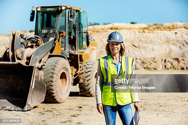 confident female architect standing at quarry - quarry work stock pictures, royalty-free photos & images