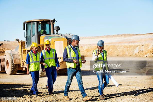 construction team walking at quarry - miner walking stock pictures, royalty-free photos & images