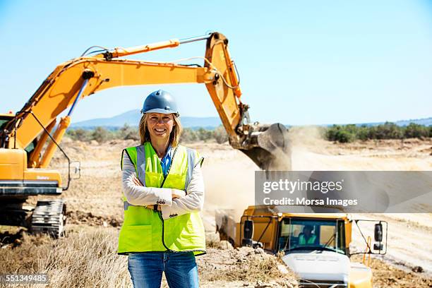 confident architect standing at quarry - earth mover stock pictures, royalty-free photos & images