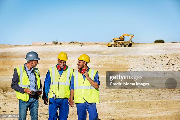 happy architects and workers on quarry - miner stock pictures, royalty-free photos & images