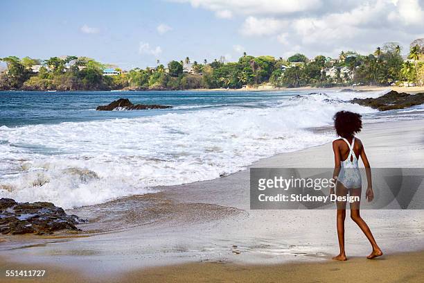 rough surf tobago beach little girl - kids swimsuit models stock pictures, royalty-free photos & images