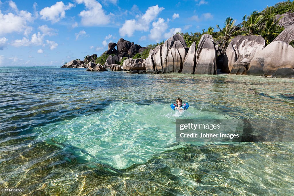 Boy swimming in sea