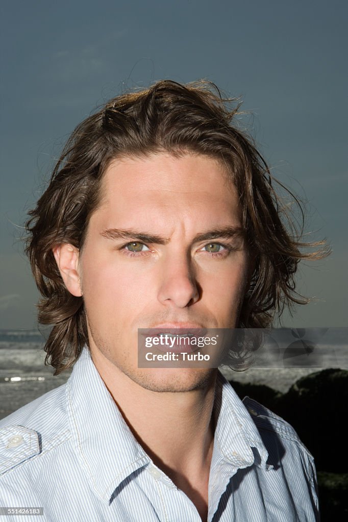 Young Man Standing on Beach