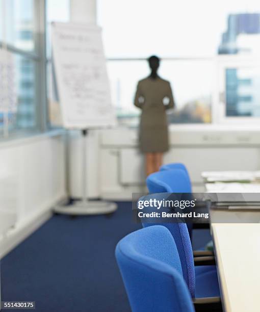 businesswoman in conference room - office chair back fotografías e imágenes de stock