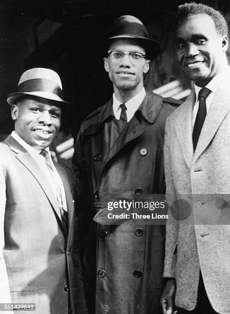 Portrait of human rights activist Malcolm X with Zambian President Kenneth Kaunda and another man, in Harlem, New York, circa 1964.