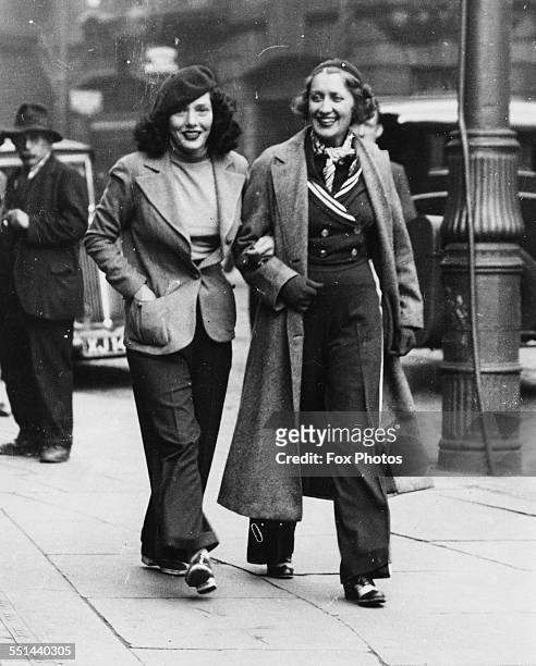 Actresses Ruth Etting and Lupe Velez, stars of the play 'Transatlantic Rhythm', walking arm in arm through the streets, England, September 19th 1936.
