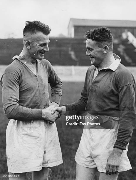 Rugby player Emrys Evans shaking hands with new player Billy Williams at Salford League Football Club, Manchester, August 11th 1939.