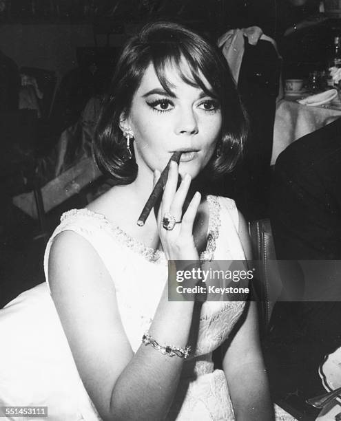 Actress Natalie Wood smoking a cigar at a charity dinner in aid of Cedars Sinai Medical Centre, at the Beverly Hilton Hotel in Los Angeles, circa...